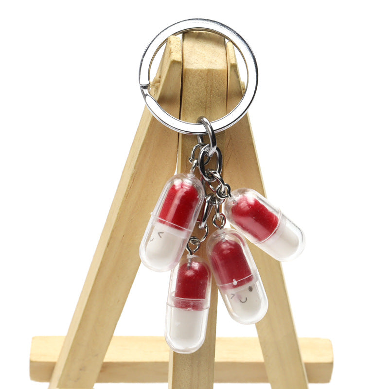 Wholesale Acrylic Cute Smiley Face Capsule Pendant Keychain